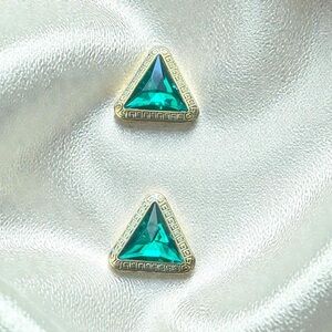 Vintage, plastic green and gold tone front, thin metal closure, used